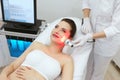 Red Led Light Treatment. Woman Doing Facial Skin Therapy Royalty Free Stock Photo