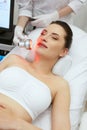 Red Led Light Treatment. Woman Doing Facial Skin Therapy Royalty Free Stock Photo