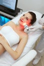 Red Led Light Treatment. Woman Doing Facial Skin Therapy Royalty Free Stock Photo