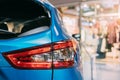 Red LED Rear Lights Of Blue color compact crossover SUV Car Nissan Qashqai In Hall Of Shopping Center. Close Up Of Light Royalty Free Stock Photo