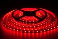 Red LED strip on reel with black background Royalty Free Stock Photo