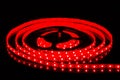 Red LED strip on reel with black background Royalty Free Stock Photo