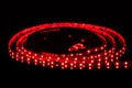 Red LED strip on reel with black background Royalty Free Stock Photo