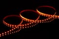 Red LED strip tape on black background Royalty Free Stock Photo