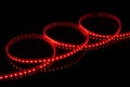 Red LED strip tape on black background Royalty Free Stock Photo