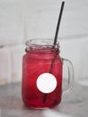 Red lemon soda water flavoured drink, Cool Drinks Beverages with ice in clear glass on white table Royalty Free Stock Photo