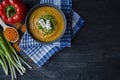 Red lentil cream soup decorated with fresh vegetables and greens. Veggie concept. Proper nutrition. View from above Royalty Free Stock Photo