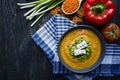 Red lentil cream soup decorated with fresh vegetables and greens. Veggie concept. Proper nutrition. View from above Royalty Free Stock Photo