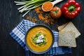 Red lentil cream soup decorated with fresh vegetables and greens. Veggie concept. Proper nutrition. View from above Royalty Free Stock Photo