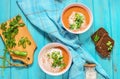 Red lentil tomato soup - delicious vegetarian food on blue wooden background. Healthy lunch Royalty Free Stock Photo