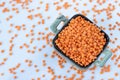 Red lentils in a bowl isolated on white background, top view Royalty Free Stock Photo