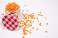 Red lentils in a glass jar, on a white background Royalty Free Stock Photo