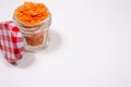 Red lentils in a glass jar, on a white background Royalty Free Stock Photo