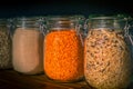 Red Lentils and Wild Rice in Jars Amongst Dry Goods in a Kitchen Pantry