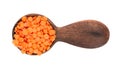 Red lentils in wooden spoon, isolated on white background. Top view. Royalty Free Stock Photo