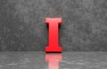 Red letter I on concrete wall an floor background series 3D render Royalty Free Stock Photo
