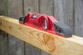 Red level tool standing on the board sideways Royalty Free Stock Photo