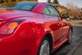 Red Lexus SC 430 parked on a street. Side view of a Lexus luxury car Royalty Free Stock Photo