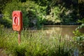 Red Life Buoy Ring by Lake Royalty Free Stock Photo