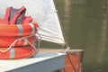 Red Life Jackets and Orange Lifebuoys, Personal Life-saving Appliances at Boat Pier