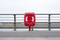 Red life safety ring buoy at port harbour harbor prevent drowning in sea cannot swim Royalty Free Stock Photo