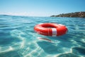 Red lifebuoy on blue water Royalty Free Stock Photo