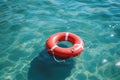 Red lifebuoy on blue water Royalty Free Stock Photo