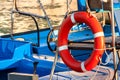 Red lifebuoy, fixed on deck of the yacht Royalty Free Stock Photo