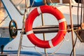 Red lifebuoy, fixed on deck of the yacht Royalty Free Stock Photo