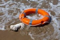 Red lifebuoy in foamy waves Royalty Free Stock Photo