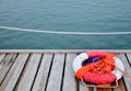 Red Lifebuoy in front of the blue sea Royalty Free Stock Photo