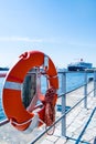 Red Lifebuoy in front of cruise ship Royalty Free Stock Photo