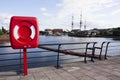 Red Lifebuoy in front of the river. Royalty Free Stock Photo