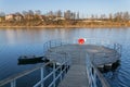 Red lifebuoy hanging on wooden pier, Jordan pond, Tabor, oldest dam in the Czech Republic, sunny autumn day, life insurance Royalty Free Stock Photo