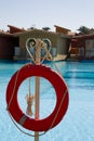 Red lifebuoy hangs on a rope Royalty Free Stock Photo