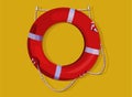 Red lifebuoy ring hanging on yellow wall. Life saving Royalty Free Stock Photo