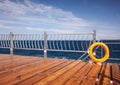 Red lifebuoy with rope on a wooden pier Royalty Free Stock Photo