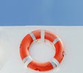 Red lifebuoy on white ferry wall Royalty Free Stock Photo