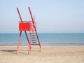 Red lifeguard chair on an empty beach Royalty Free Stock Photo