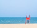 Red lifeguard chair on an empty beach Royalty Free Stock Photo