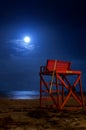 A red lifeguard stand on the beach at night. Royalty Free Stock Photo
