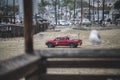 Red Lifeguard truck with a surfboard on top at Newport Beach, California, USA