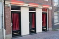 Red light district in Amsterdam. Windows and doors where prostitutes work