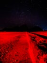 Red light on an empty path under the milky way stars Royalty Free Stock Photo