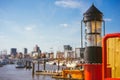 Red light lantern in HafenCity. ght. Port piers with ships and yacht at anchor in background. Hamburg, Germany