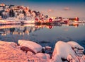 Red light lanterns illuminated of the shore of Reine town, Norway, Europe Royalty Free Stock Photo