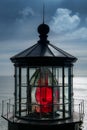 Red light reflecting through the fresnel lens in the cupola of a lighthouse Royalty Free Stock Photo