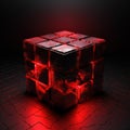 a red light shines on a cube shaped object on a black background Royalty Free Stock Photo