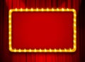 Red light sign with gold frame on theatre or cinema curtain Royalty Free Stock Photo