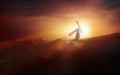 The red light of the sunset hill and Jesus carrying the cross of suffering Royalty Free Stock Photo